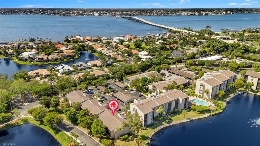 Drone / aerial view with a residential view and a water view