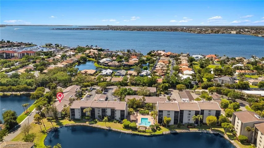 Drone / aerial view featuring a water view and a residential view