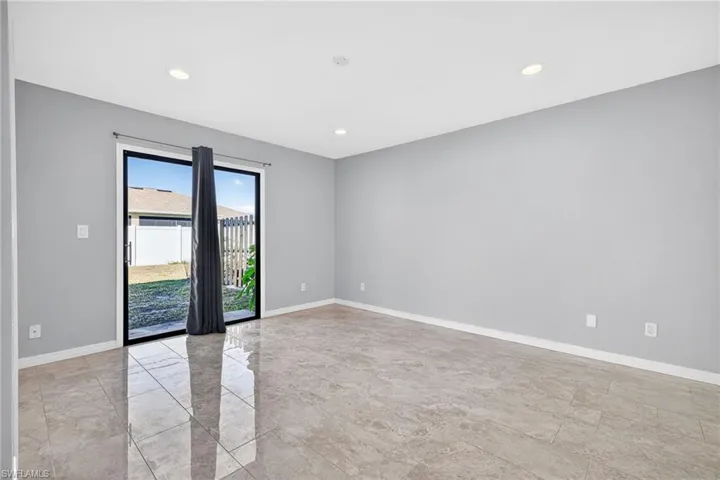 Spare room with recessed lighting and light marble finish flooring