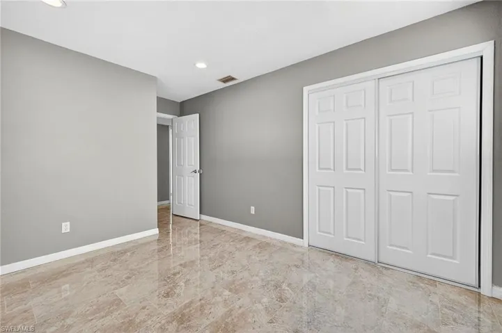 Unfurnished bedroom featuring a closet and recessed lighting
