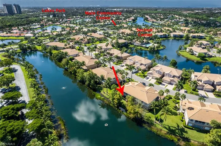Aerial perspective of suburban area featuring a large body of water