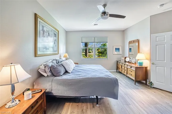 Bedroom with light wood-style floors and ceiling fan