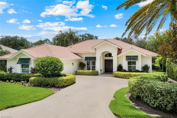 Charming home with Bahama Shutters on the front elevation