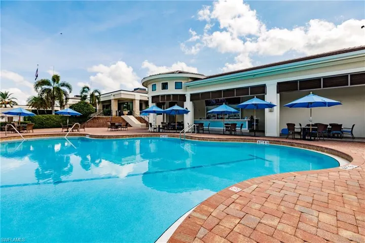 Aqua resort pool and dining area at Vineyards Country Club