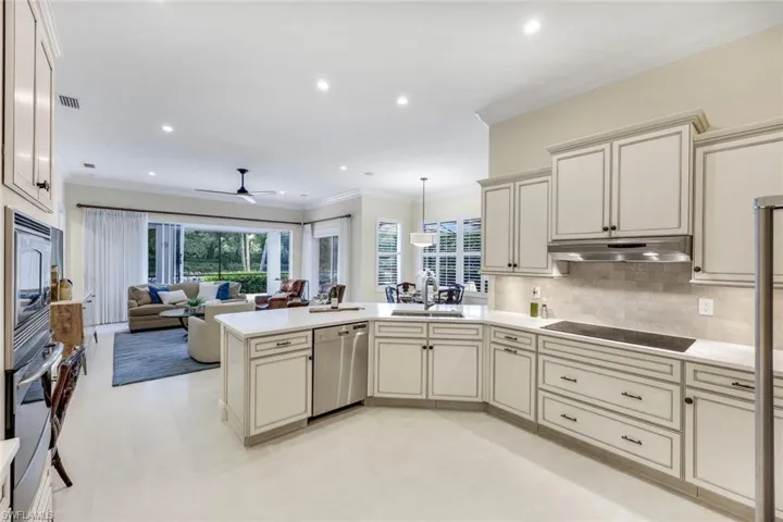 Neutral tones in the kitchen flow into the family room