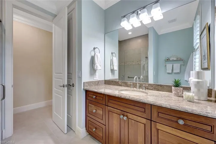 Guest bathroom with walk in frameless glass enclosed shower