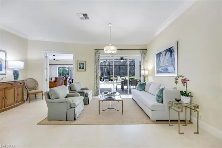Formal living room with views to pool and lake