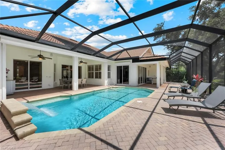 Solar heated pool with waterfall feature and deck with two undercover seating/dining areas