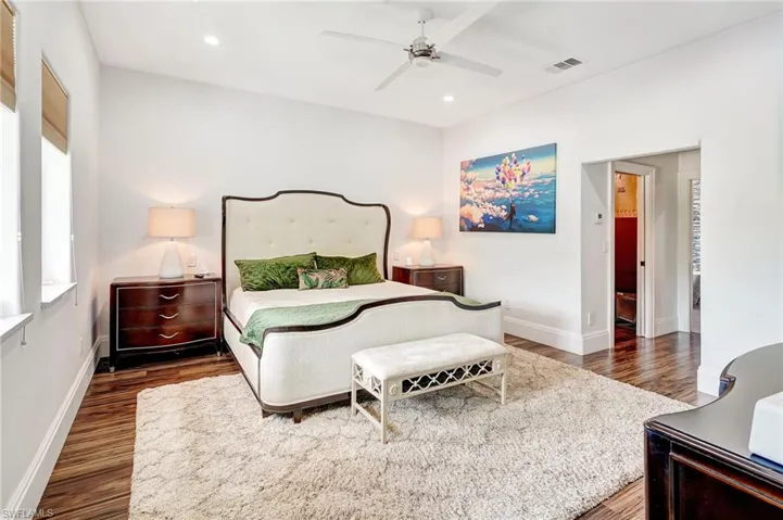 Bedroom featuring dark wood finished floors, recessed lighting, and a ceiling fan