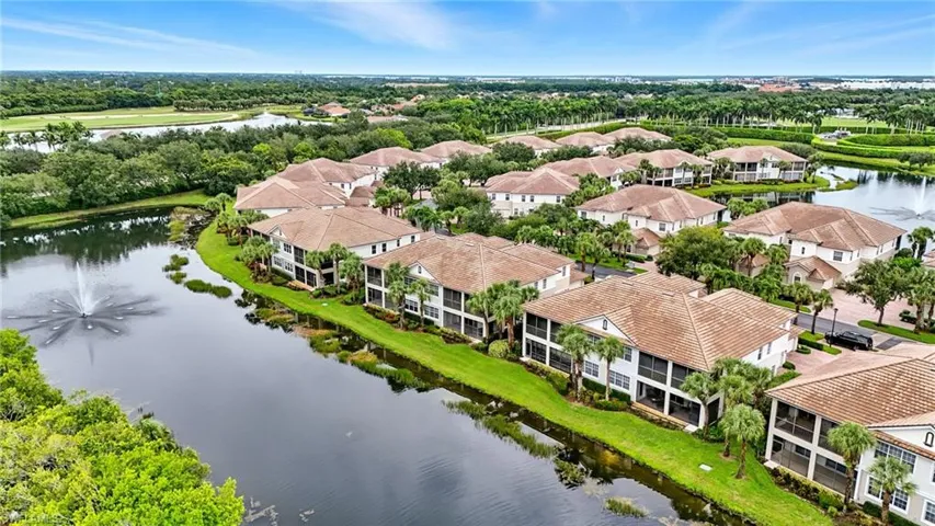 Bird's eye view of a nearby body of water and a tree filled landscape