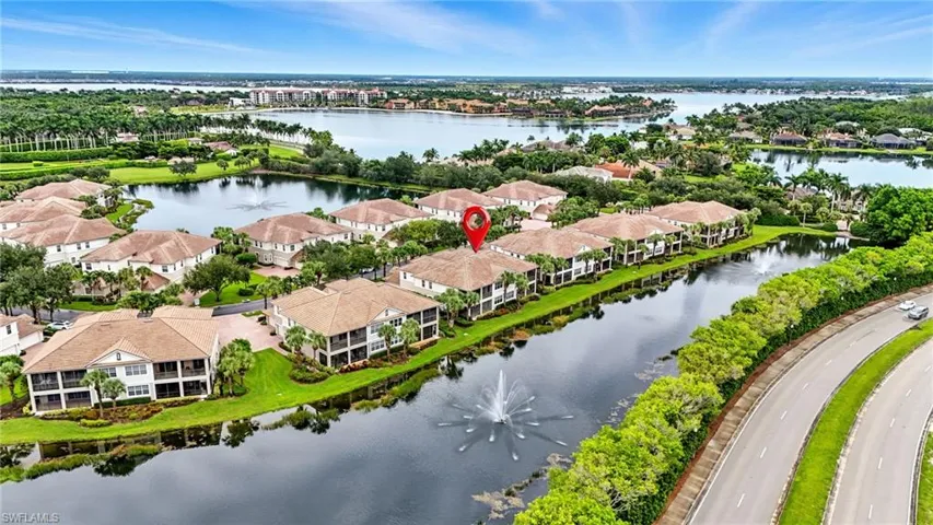 Aerial perspective of suburban area with a large body of water