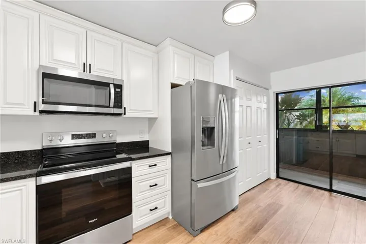 Thick slab stone countertops and plenty of cabinet space with 8' ceilings
