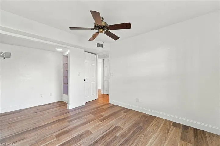 1 of the 2 guest bedrooms with a large closet area inset