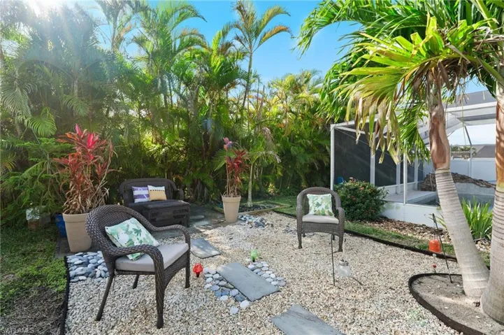 View of patio featuring a lanai