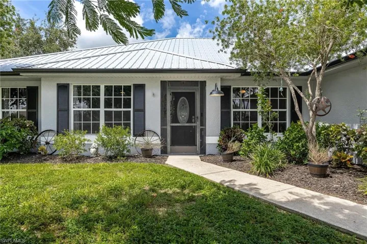 Property entrance with a yard