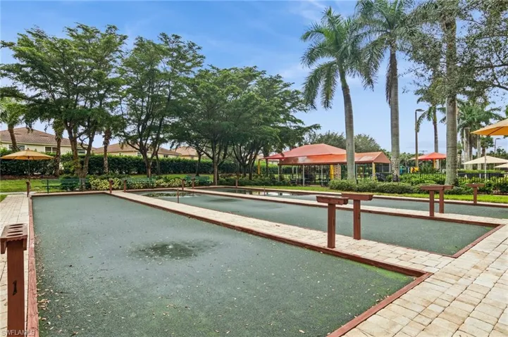 View of property's community with a game area