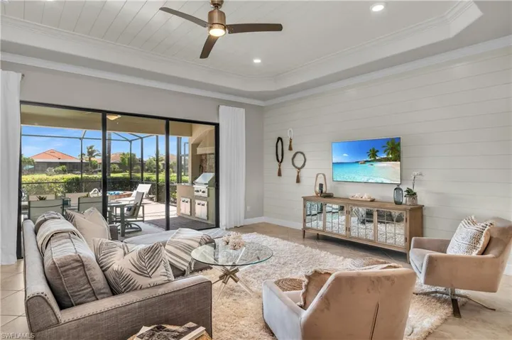 Coastal Comfort and Feel.  Shiplap features in tray ceiling, wall to wall, as trim and on large center Island.