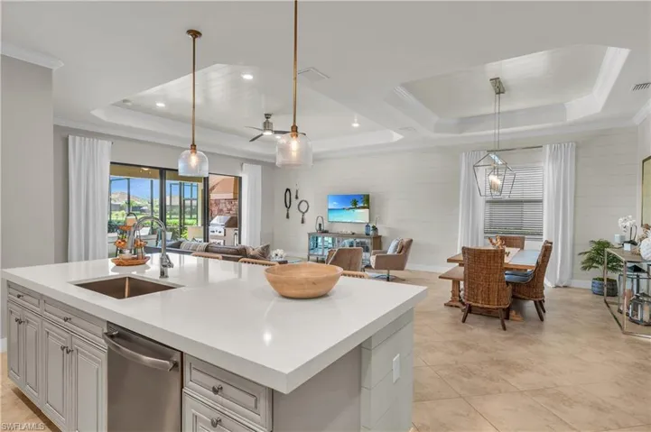 Open Great Room leading out to pool with shiplap in tray ceilings, the island and the walls....must see in person!