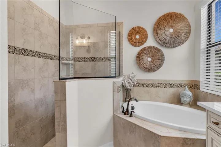 Primary Bath with double vanity and walk-through shower.