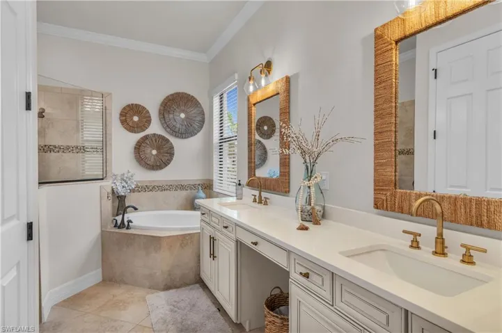 Large Master Bath with soaking tub,  double vanity sinks, upgraded faucets and large walk-in shower.