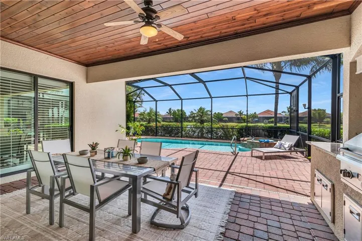 Large screened in lanai with tongue n groove ceiling, Summer kitchen and access to master bedroom and great room