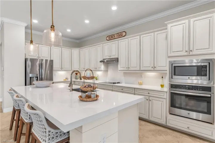 New Quartz countertops on the center island and the walls vs backsplash.  Open and Airy!