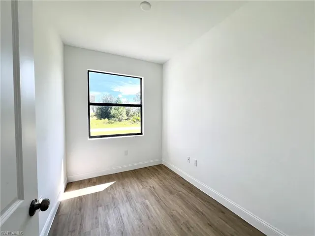 Empty room featuring light wood-type flooring