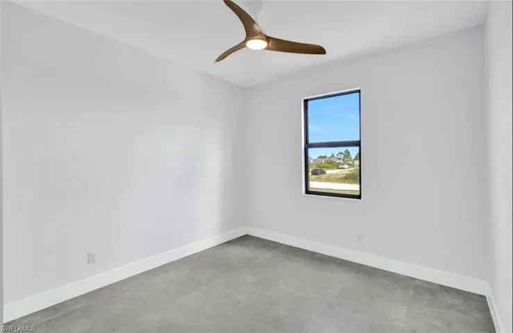 Spare room featuring ceiling fan