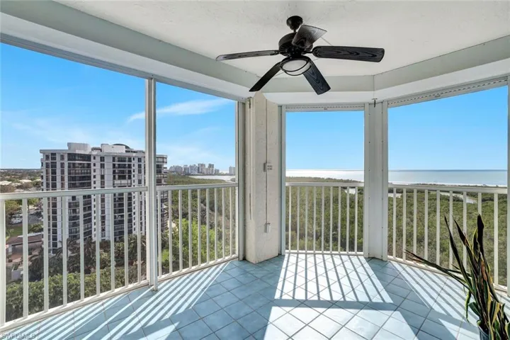 Screened-in sunroom featuring an amazing view,