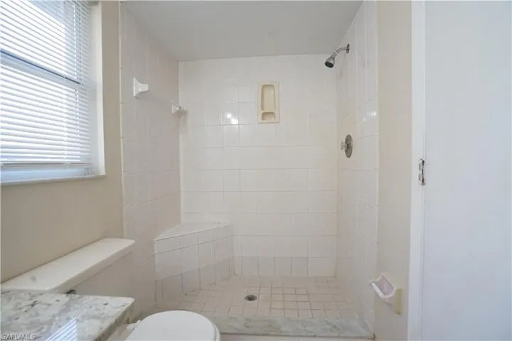 Bathroom with a shower stall and vanity