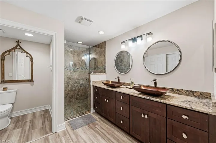 The primary ensuite bath has been freshly painted in soft, neutral tones, creating a serene and inviting atmosphere.