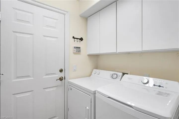 The laundry room offers additional storage, providing both convenience and functionality.