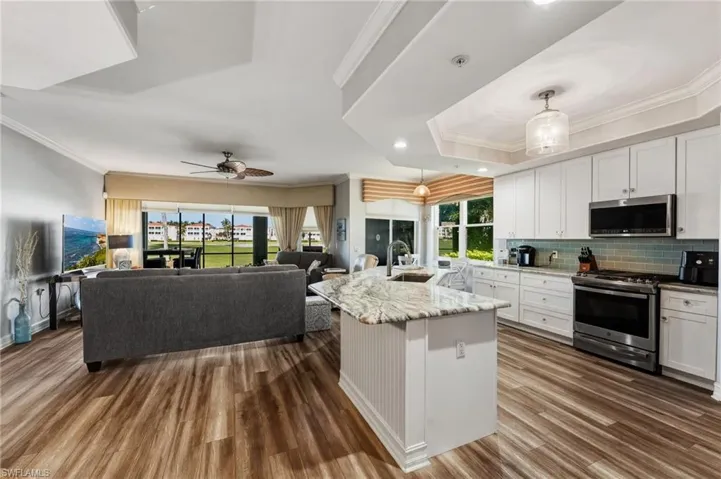 Stunning luxury vinyl flooring flows seamlessly throughout the home, creating a cohesive and expansive feel.