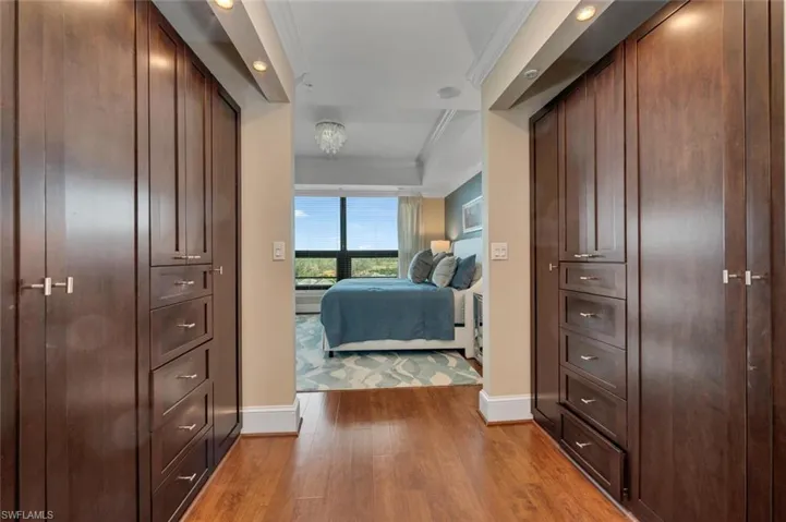 Bedroom featuring light hardwood / wood-style flooring and ornamental molding