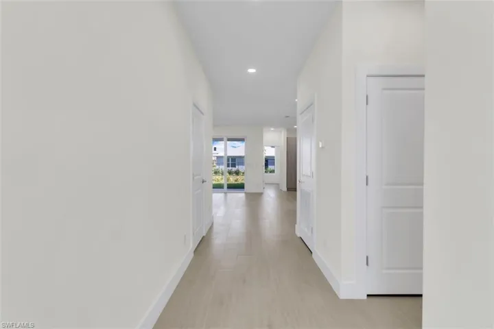 Hall featuring recessed lighting and light wood-style flooring