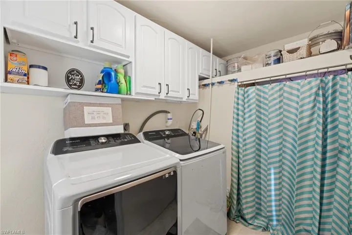 Laundry room featuring washer and clothes dryer