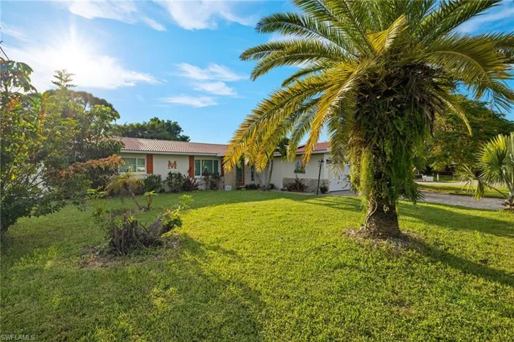 View of front of house with a front lawn
