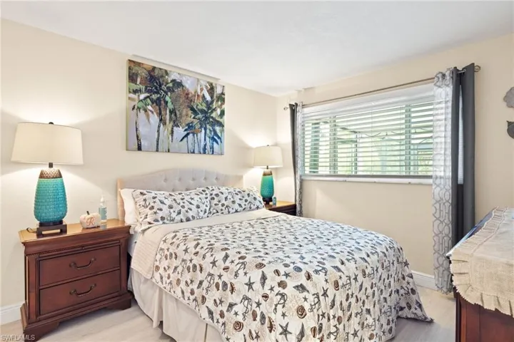 Bedroom with light hardwood / wood-style flooring