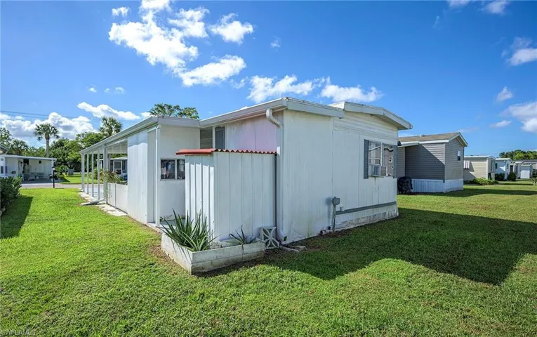 View of home's exterior featuring a yard