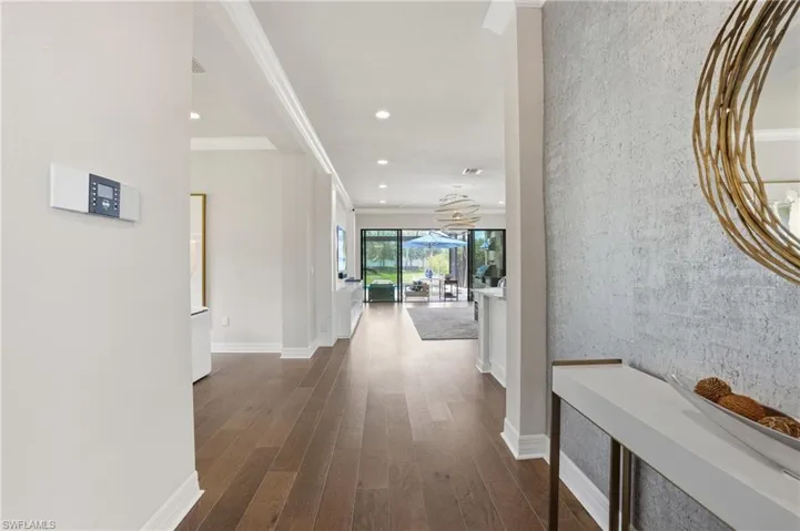 Spacious entryway with dark wood-finish flooring