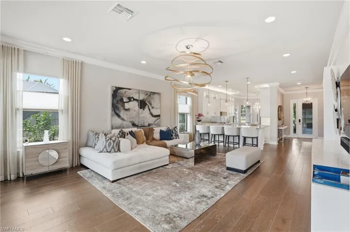 Open-concept living space with wood-finish flooring