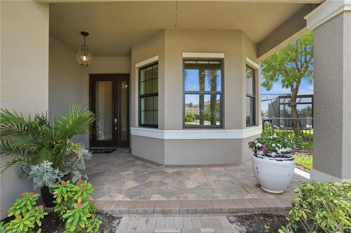 Covered entry with stone paver flooring
