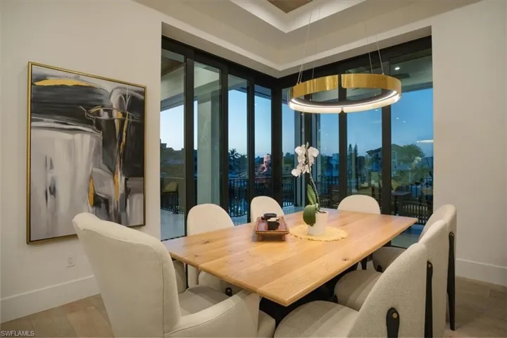 Dining area with baseboards and wood finished floors
