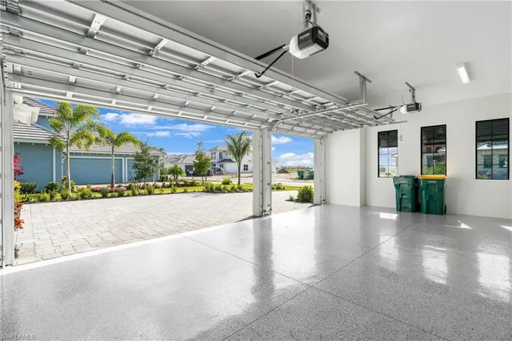 Garage featuring a garage door opener