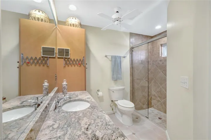 En suite guest bathroom with walk-in shower.