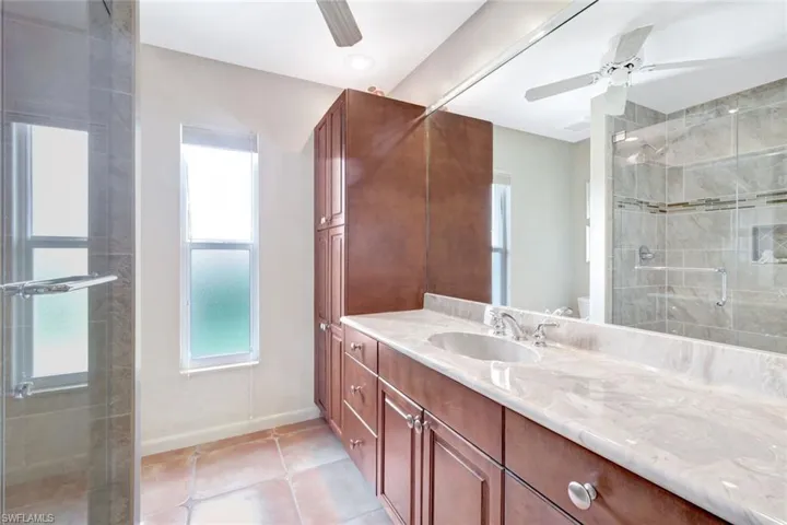Large guest bathroom located between two guest suites.
