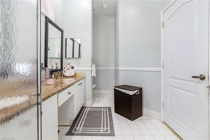 Bathroom with vanity and light tile patterned floors