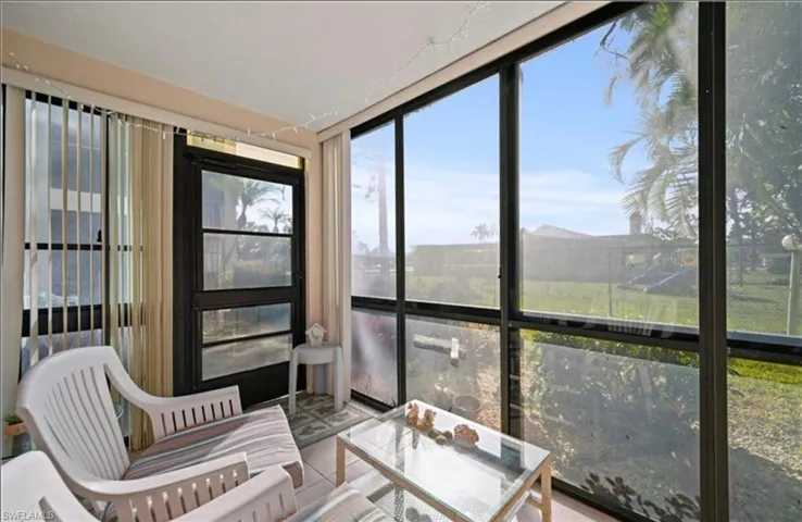 Sunroom featuring healthy amount of natural light and floor to ceiling windows