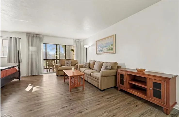 Living room featuring wood finished floors and baseboards