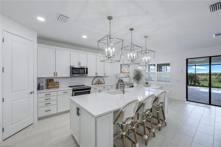 Oversized center island with beautiful quartz counters.